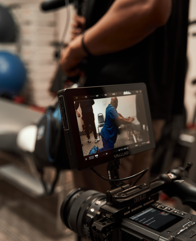 Dallas video production team member setting up camera equipment